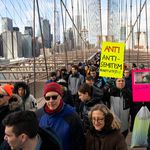 People take part in a march crossing the Brooklyn Bridge in solidarity with the Jewish community after recent string of anti-semitic attacks throughout the greater New York area, on in New York
